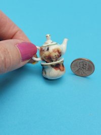 Porcelain Teapot on Burner Cupi
